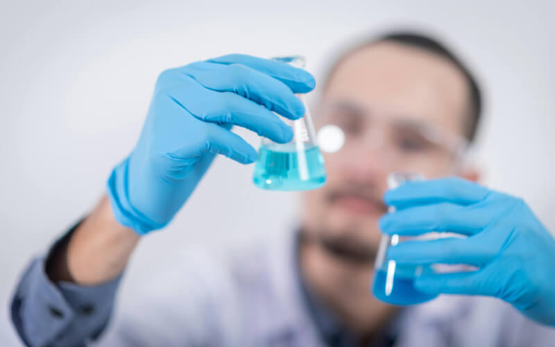 A person holding flasks