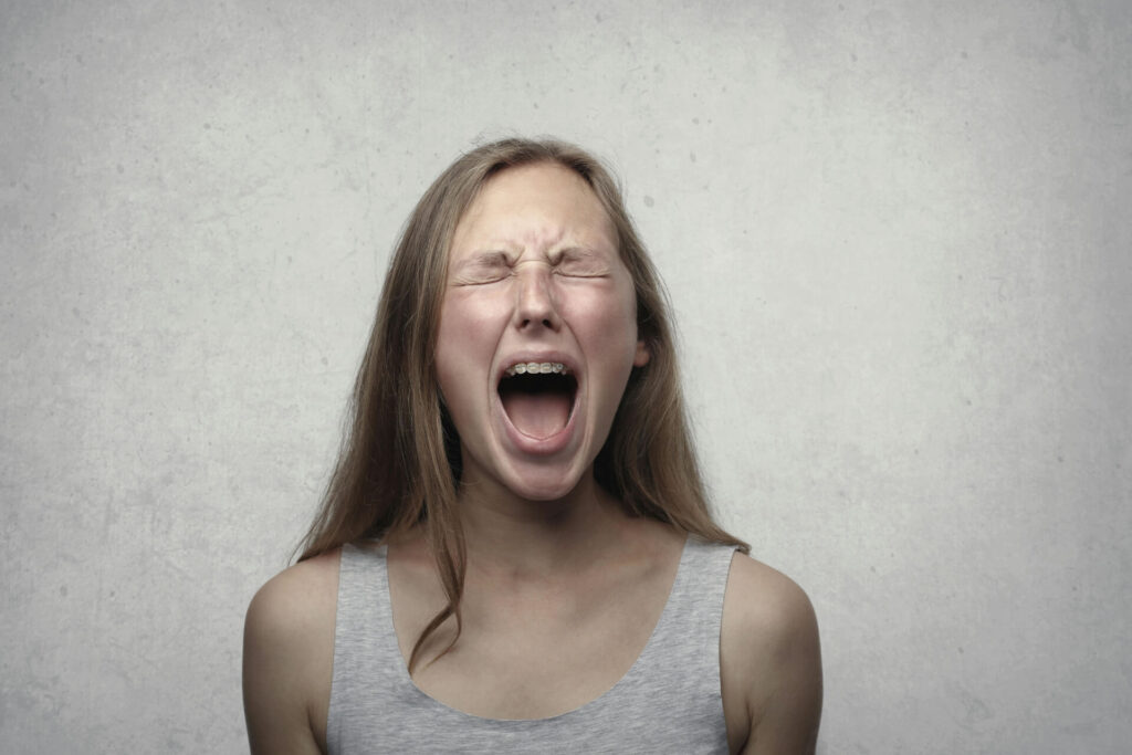 A teen screaming