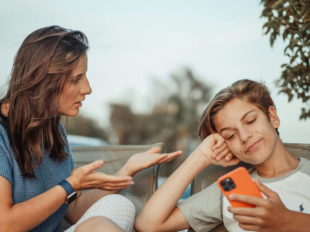 A mother talking to her son but he was ignoring her