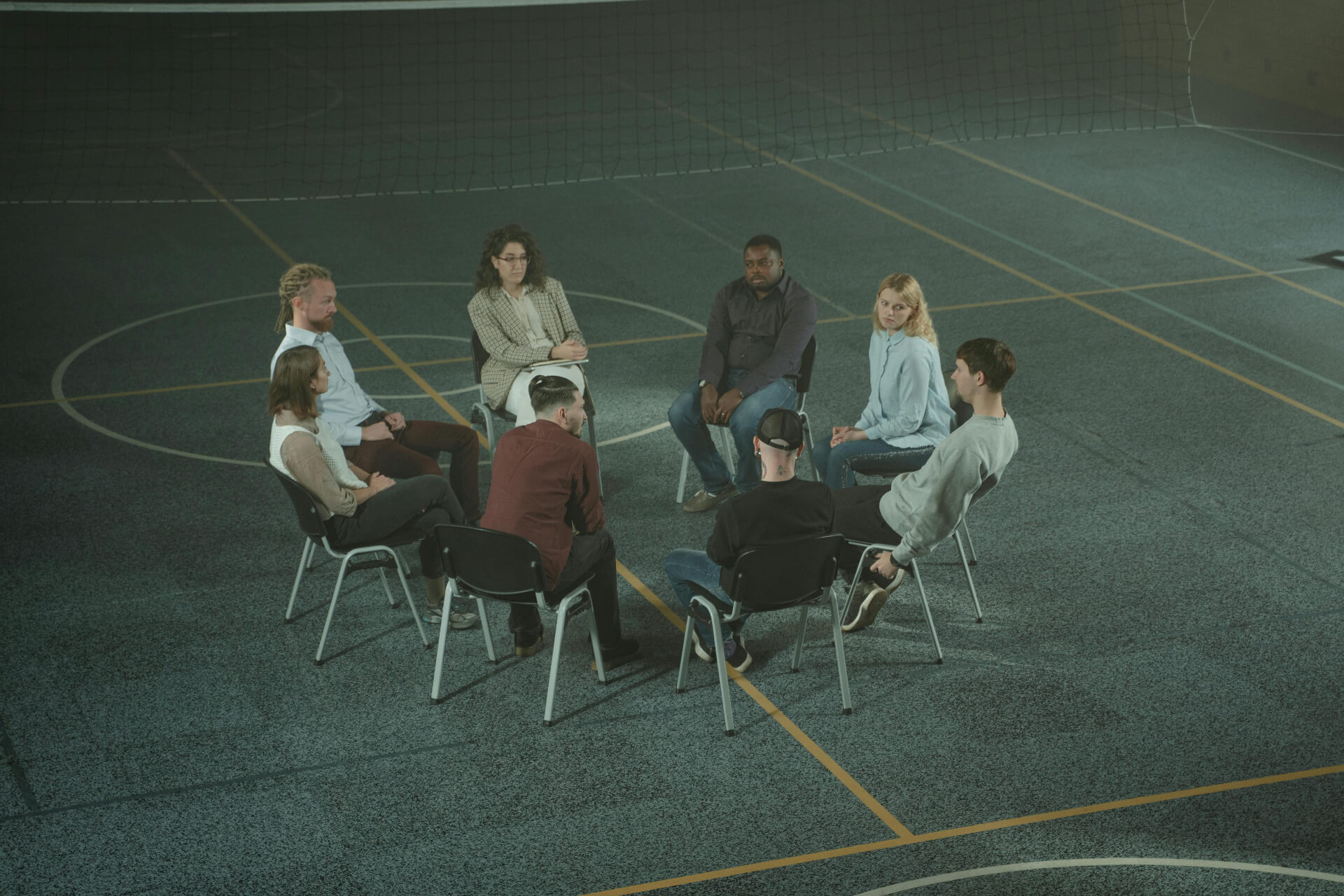 A group of people in a therapy session