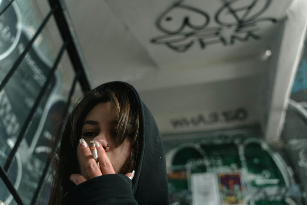 A woman using a cigarette