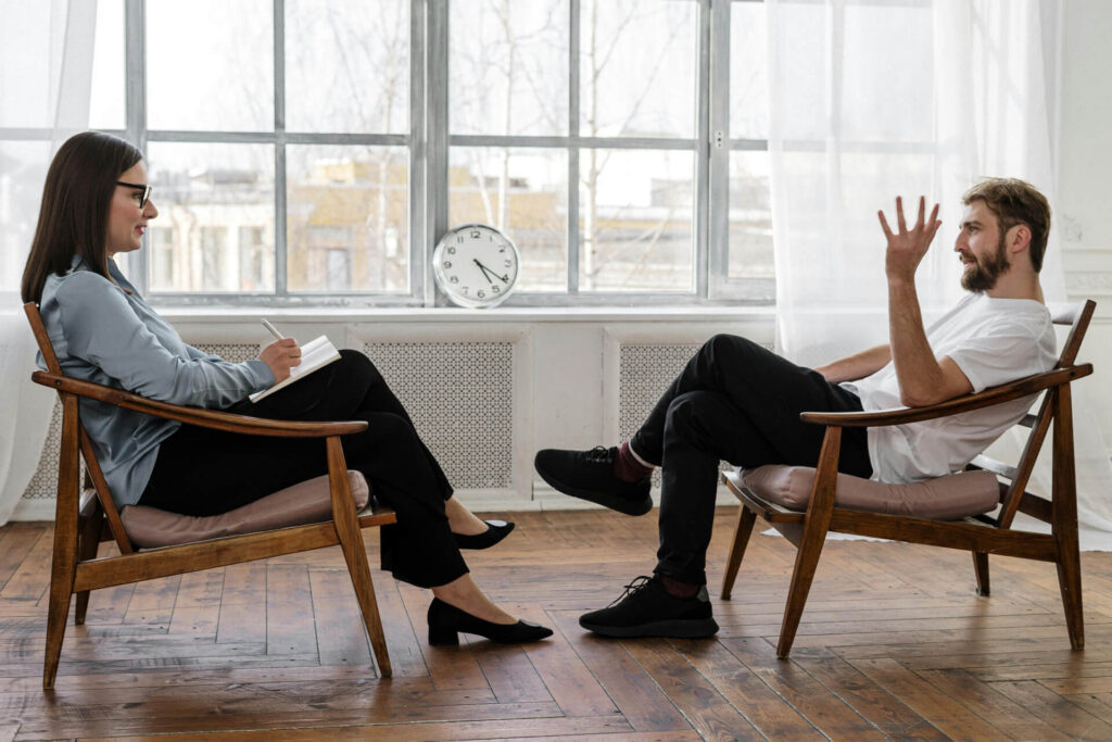 A therapists talking to her patient